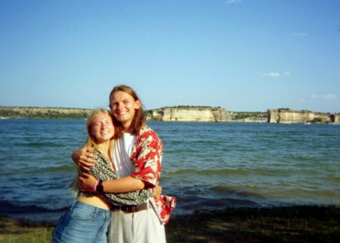 Jillian stands with her boyfriend, Matt, in front of the lake where they worked for summer camp.