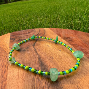 The Earth Anklet with lime green, dark green, and blue beads with green fluorite accents.