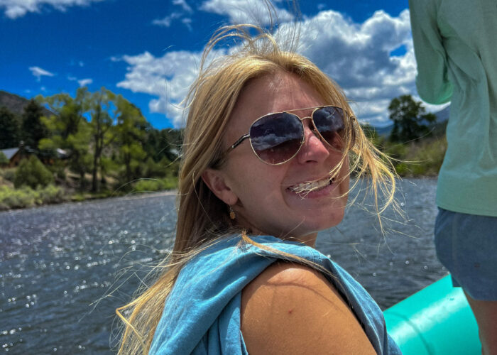 Jillian smiles at the camera while she rafts down the Rio Grande River in Colorado.
